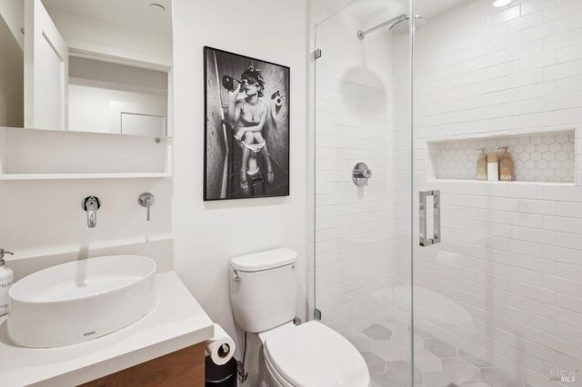 a view of a backyard with furniture and a tub