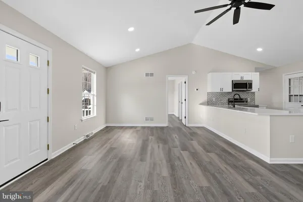 a kitchen with a refrigerator a sink and dishwasher
