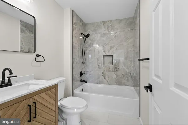 a view of a livingroom with a ceiling fan and window