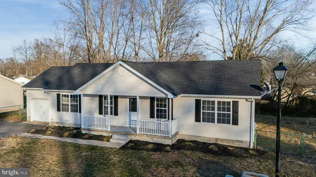 an aerial view of houses with outdoor space