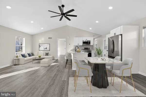 a view of a kitchen with a sink and microwave