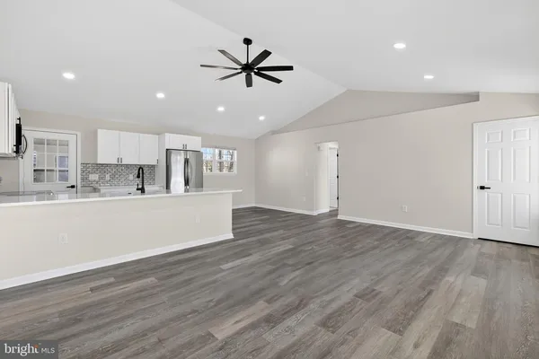 a view of a kitchen with electric appliances