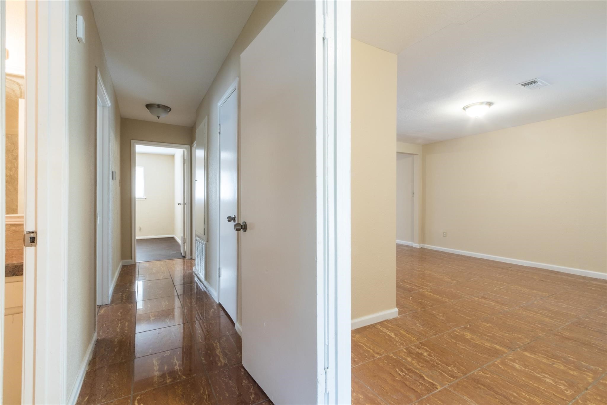 3823 Heatherbrook Drive Houston, TX 77045 - Photo 6 of 11 a view of hallway with wooden floor