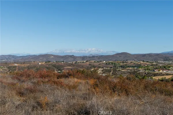 a view of a mountain range with trees