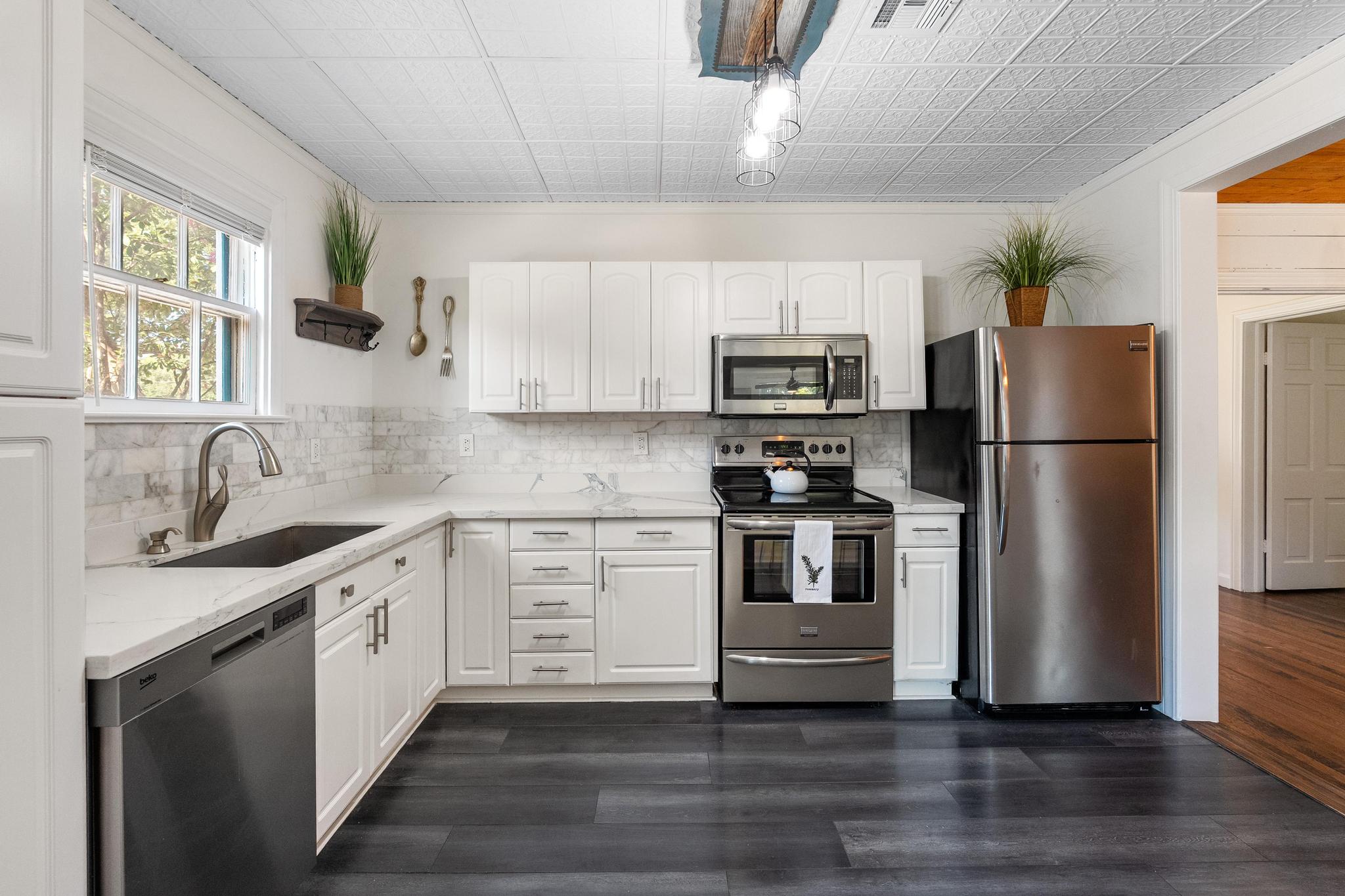 1707 Lexington Street Taylor, TX 76574 - Photo 8 of 29 a kitchen with a refrigerator stove and sink