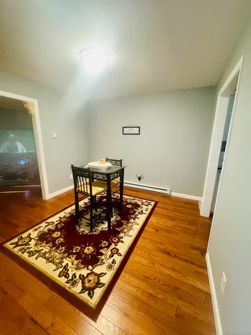 a living room with a rug