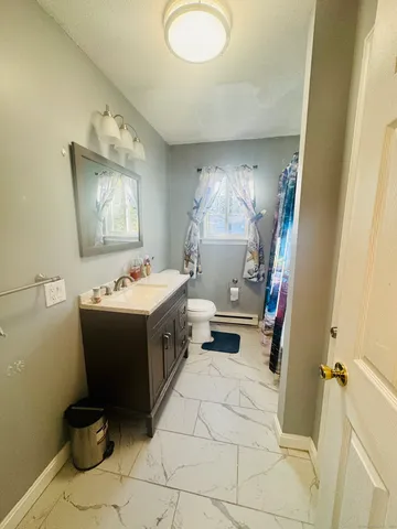 a bathroom with a sink and mirror