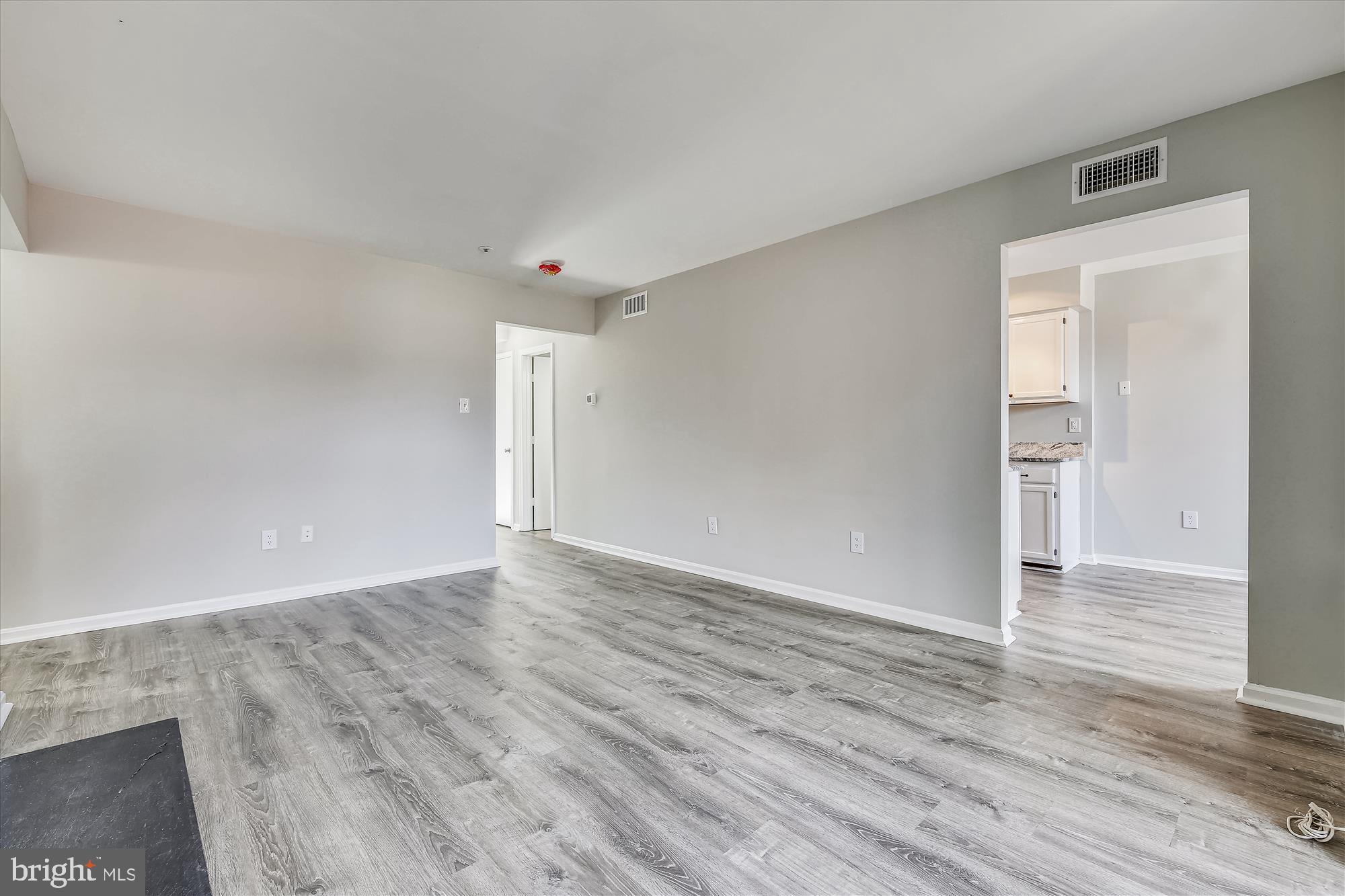 14902 McKisson Court, Unit 8BE Silver Spring, MD 20906 - Photo 8 of 38 Living Room With View to Kitchen
