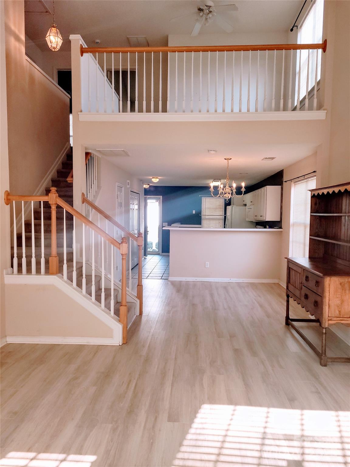 16740 Timber Crossing Road Charlotte, NC 28213 - Photo 5 of 7 a view of a living room and entryway with wooden floor