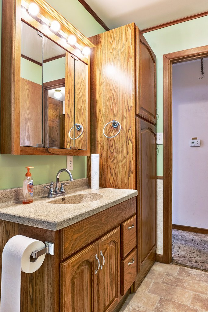 114 South Madison Street Saybrook, IL 61770 - Photo 19 of 31 a kitchen with a sink and a refrigerator