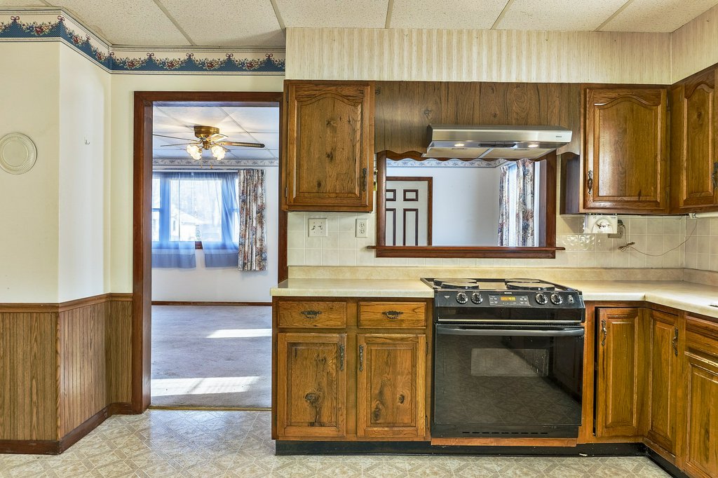 114 South Madison Street Saybrook, IL 61770 - Photo 9 of 31 a kitchen with a stove and a sink