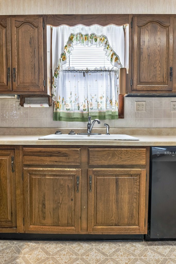 114 South Madison Street Saybrook, IL 61770 - Photo 10 of 31 a kitchen with stainless steel appliances granite countertop a sink and cabinets