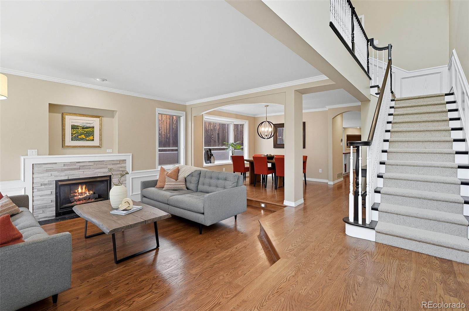 358 Steele Street Denver, CO 80206 - Photo 11 of 48 a living room with furniture and a fireplace