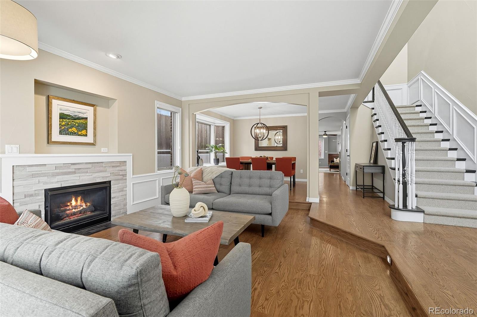 358 Steele Street Denver, CO 80206 - Photo 12 of 48 a living room with furniture and a fireplace