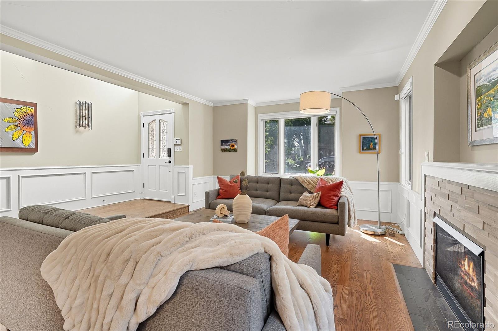 358 Steele Street Denver, CO 80206 - Photo 13 of 48 a living room with furniture and a fireplace