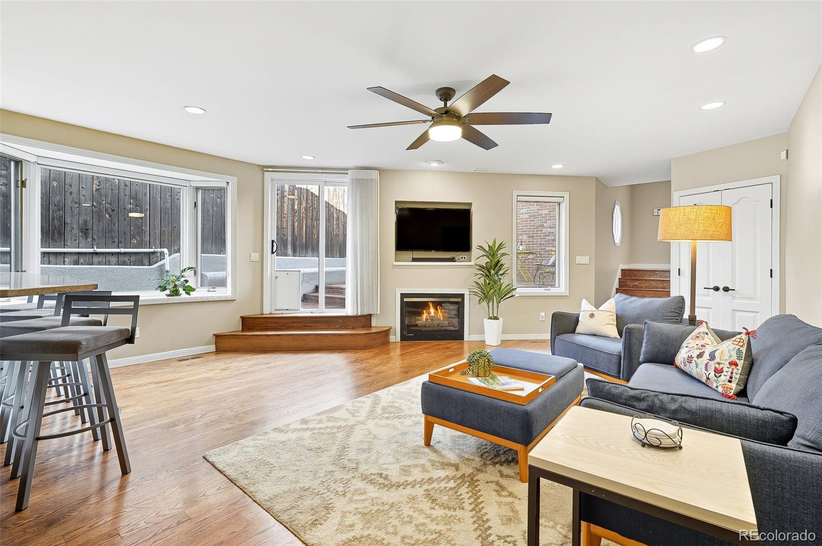 358 Steele Street Denver, CO 80206 - Photo 18 of 48 a living room with furniture and a fireplace
