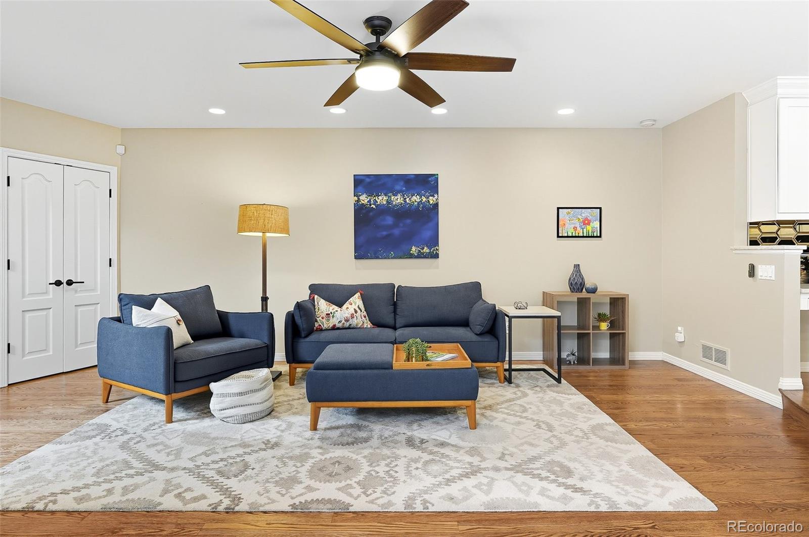 358 Steele Street Denver, CO 80206 - Photo 19 of 48 a living room with furniture and a wooden floor
