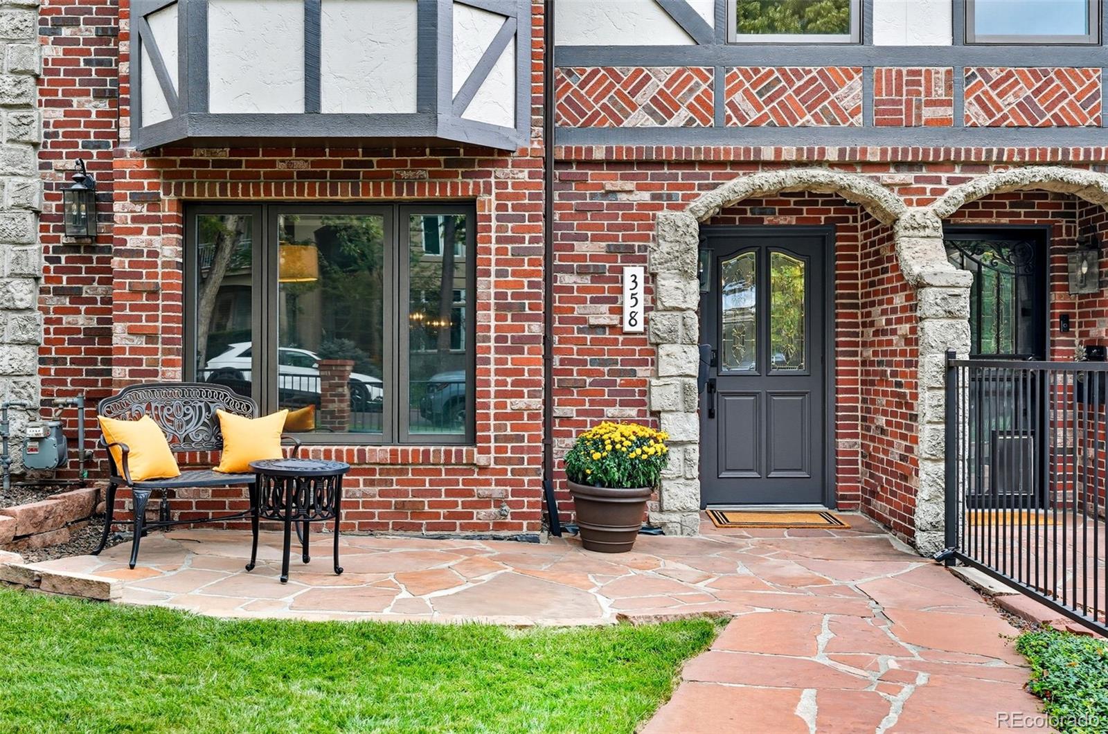 358 Steele Street Denver, CO 80206 - Photo 2 of 48 a view of front door of house with outdoor seating