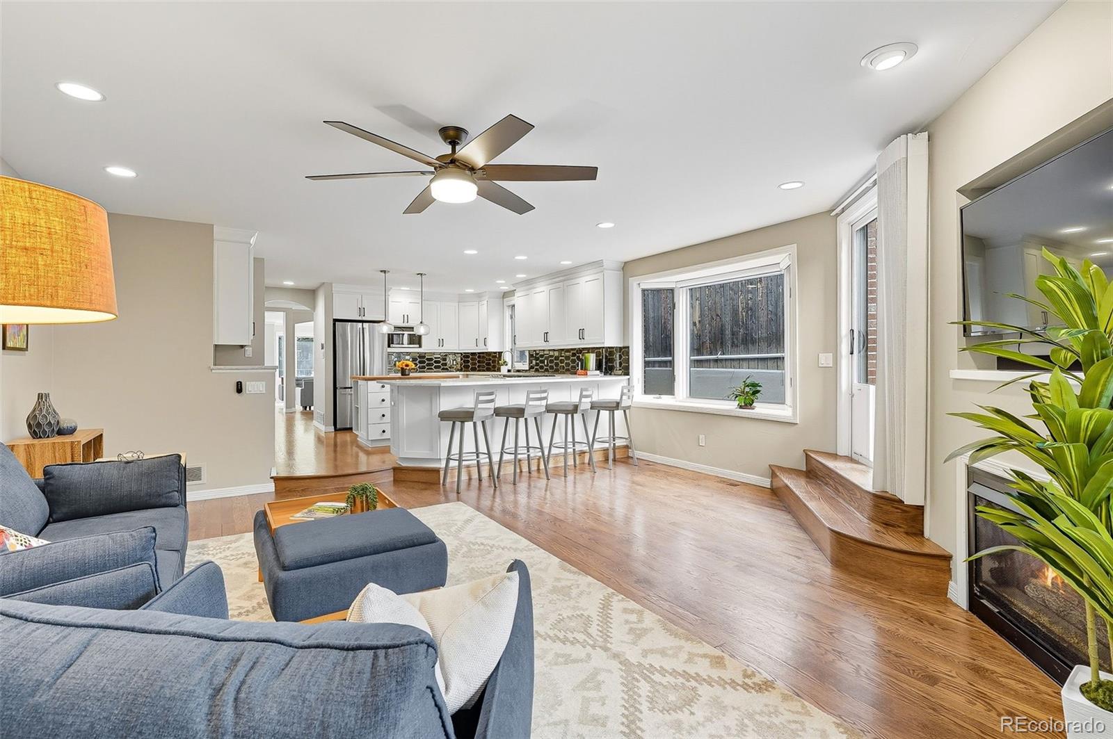 358 Steele Street Denver, CO 80206 - Photo 21 of 48 a living room with furniture and a wooden floor