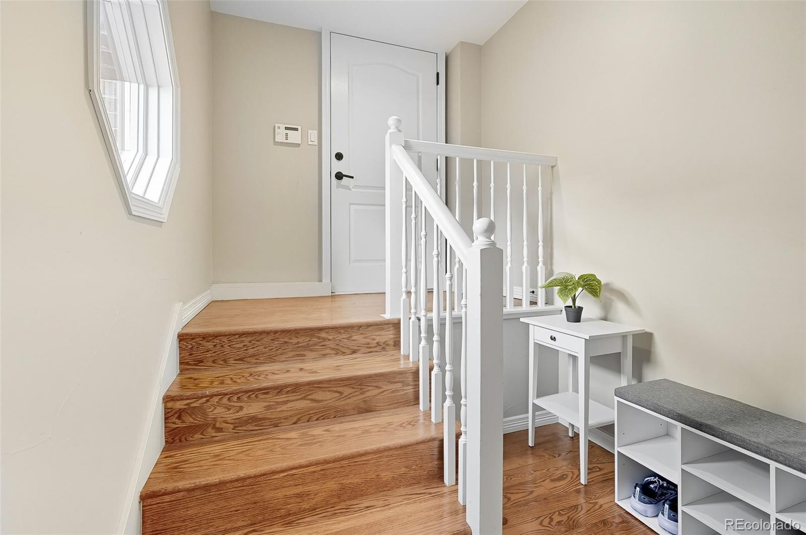358 Steele Street Denver, CO 80206 - Photo 22 of 48 a view of entryway and hall with wooden floor