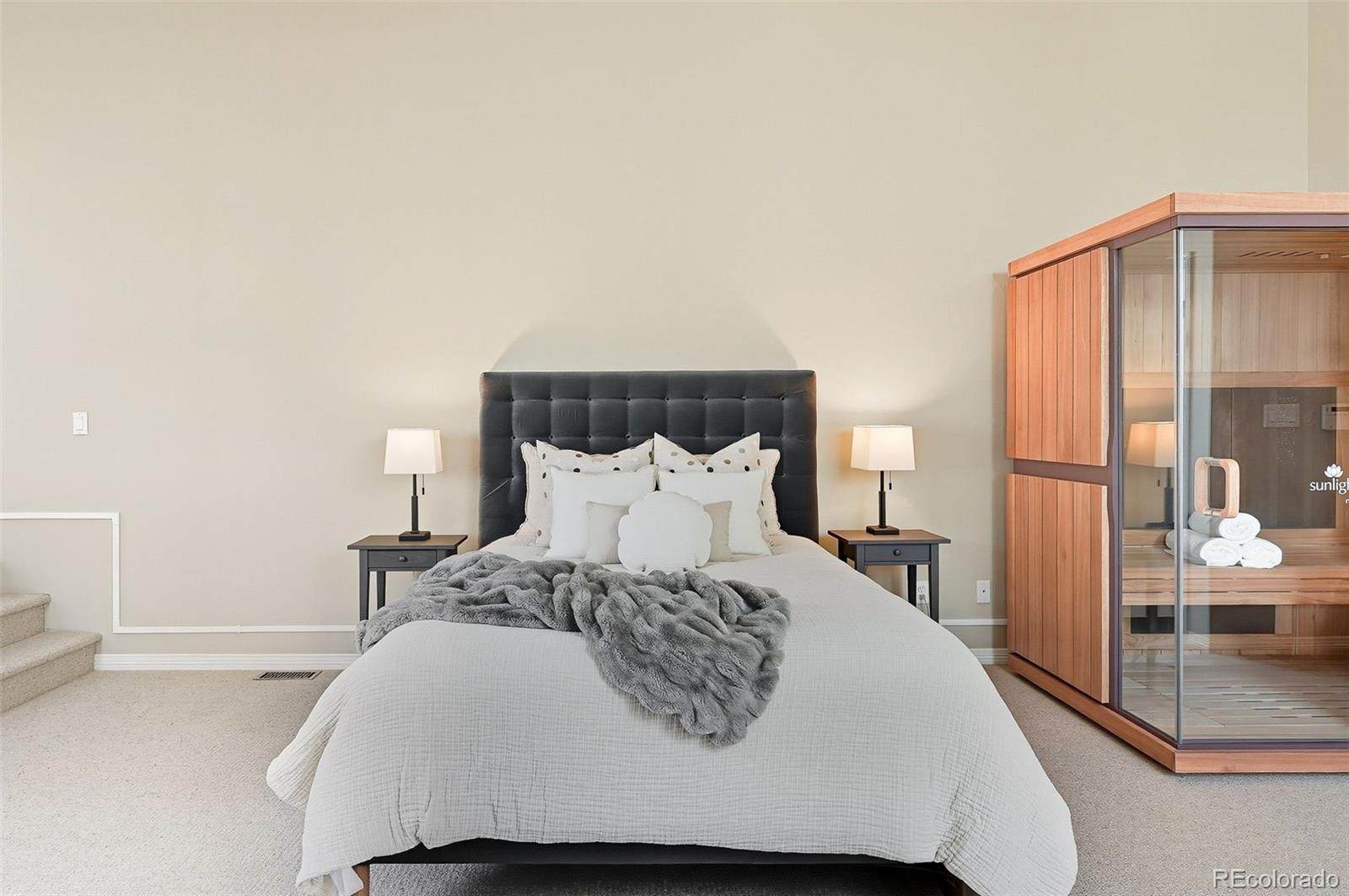 358 Steele Street Denver, CO 80206 - Photo 27 of 48 a bed sitting in a bedroom next to a window