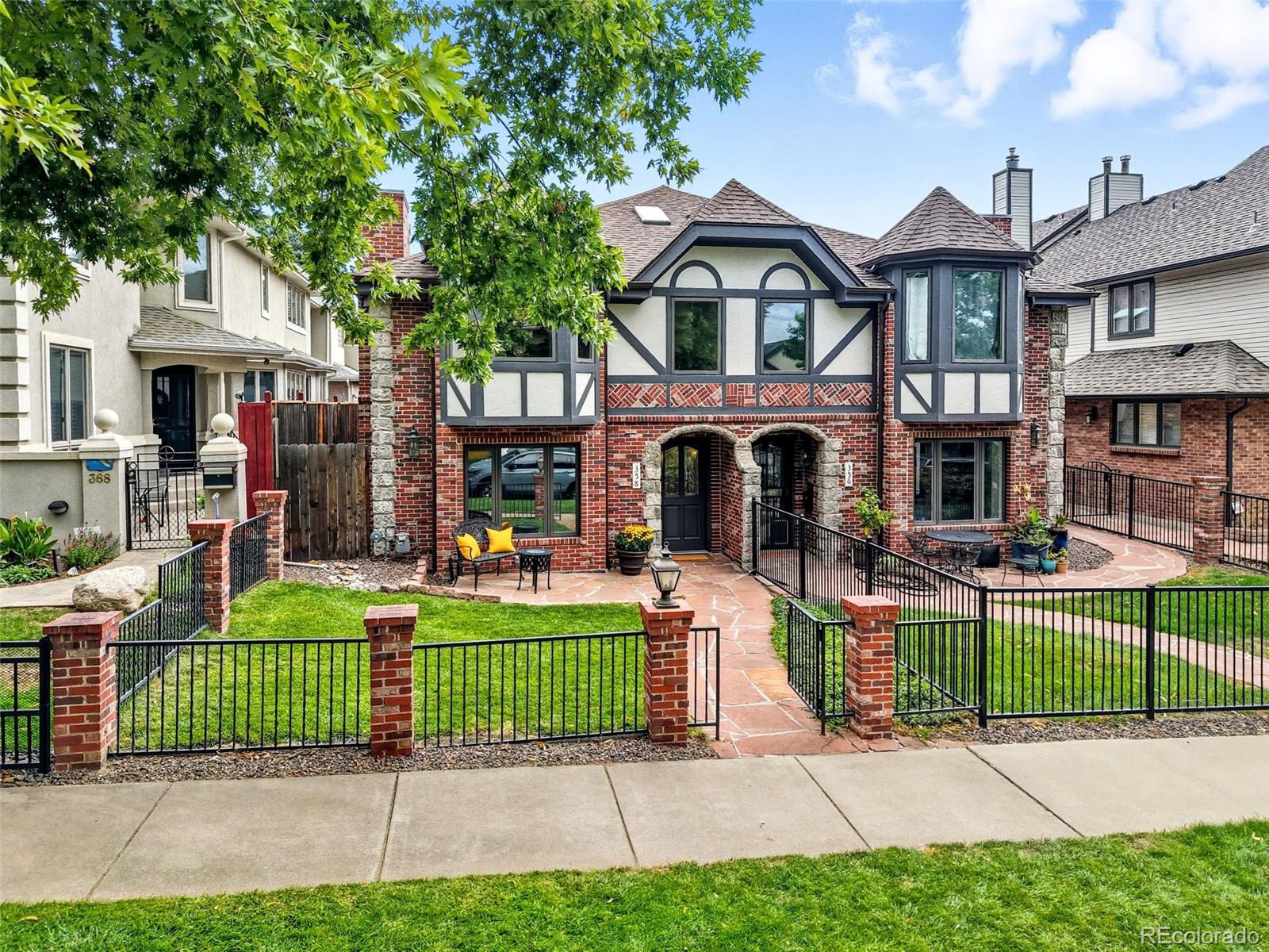 358 Steele Street Denver, CO 80206 - Photo 3 of 48 a front view of a house with a garden and plants