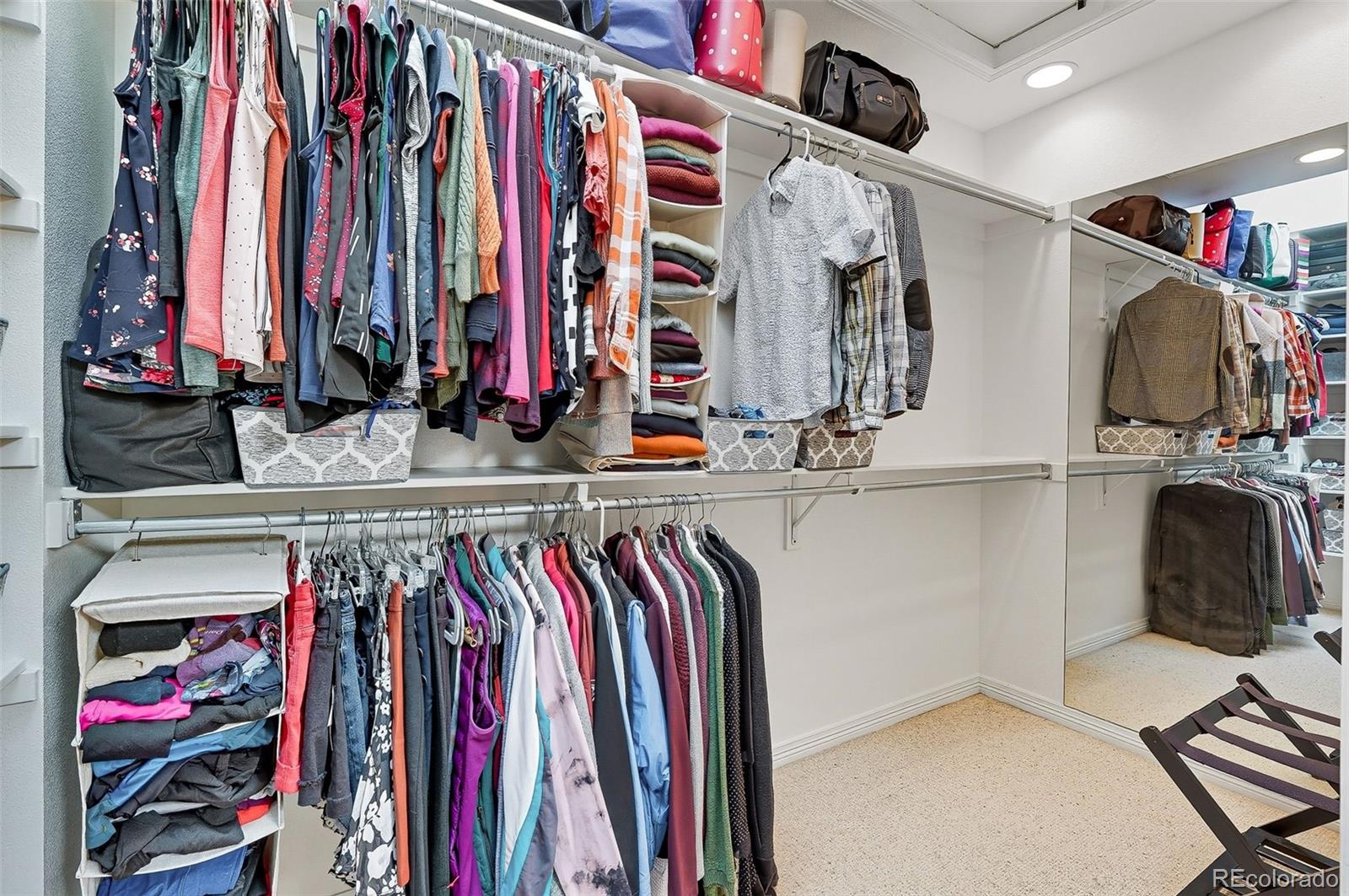 358 Steele Street Denver, CO 80206 - Photo 32 of 48 a view of walk in closet with clothes and shoes