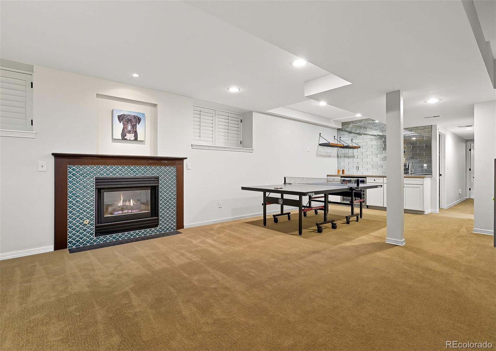 358 Steele Street Denver, CO 80206 - Photo 36 of 48 a room with furniture and a fireplace