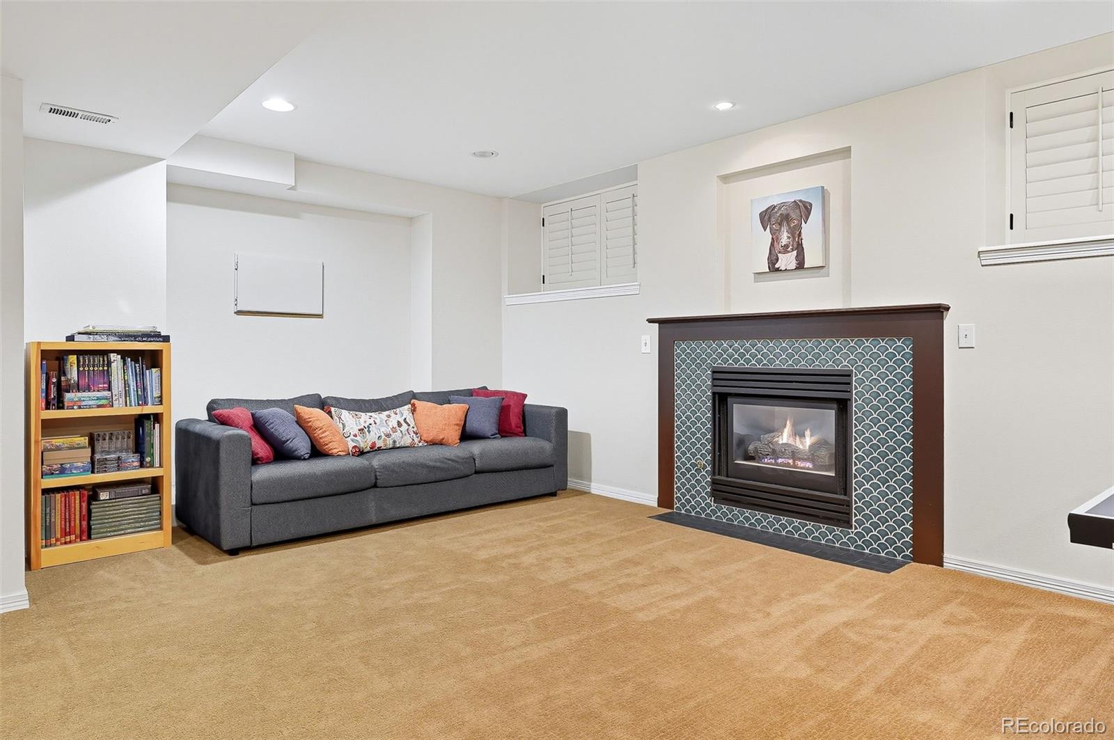 358 Steele Street Denver, CO 80206 - Photo 38 of 48 a living room with furniture and a fireplace