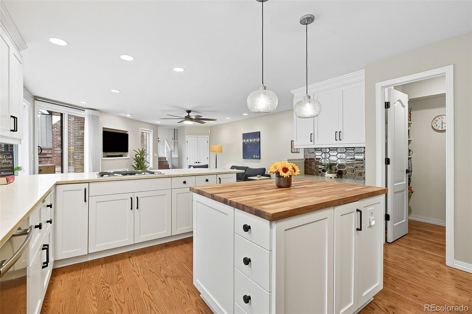 358 Steele Street Denver, CO 80206 - Photo 6 of 48 a kitchen with white cabinets and sink