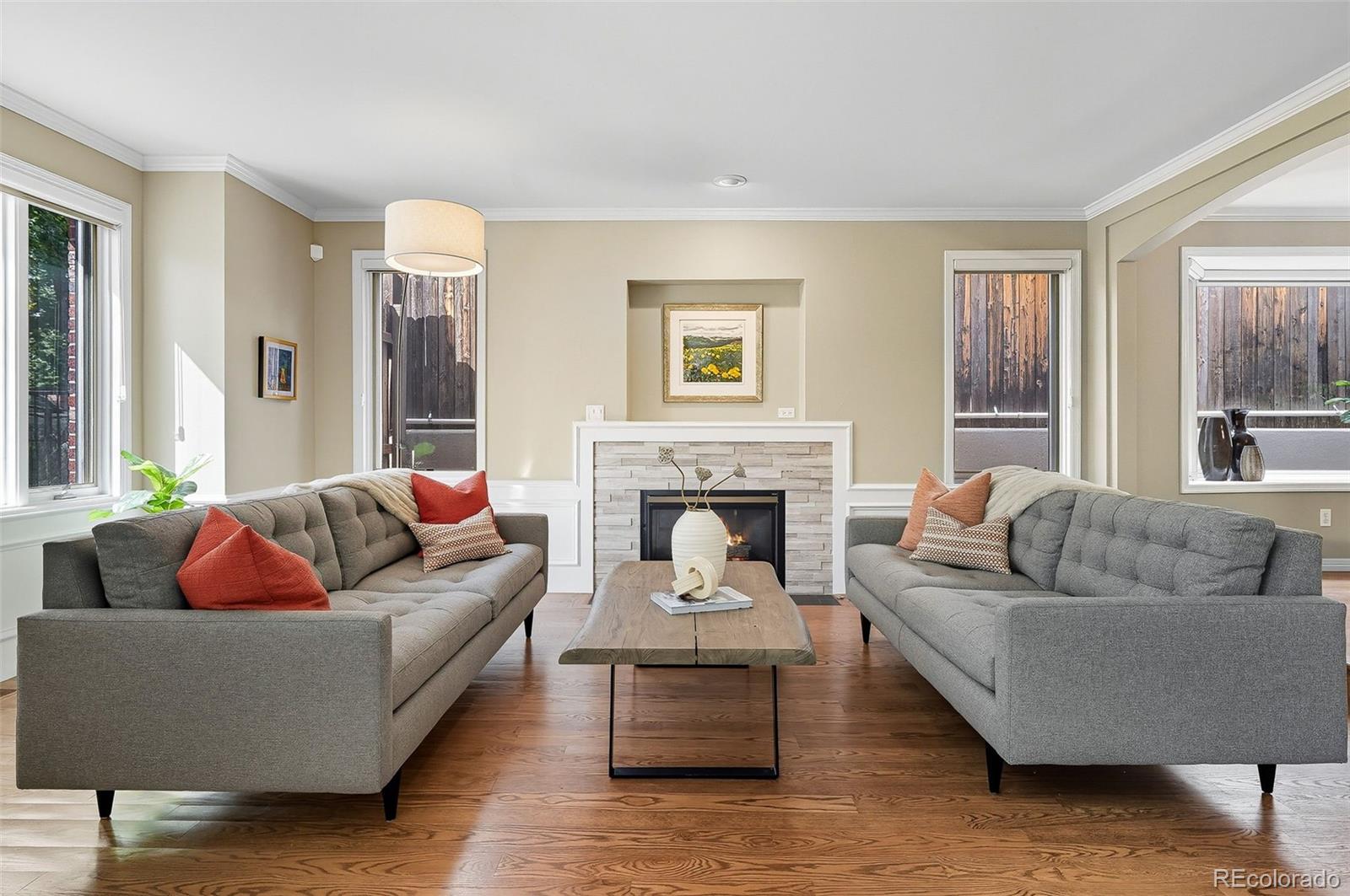 358 Steele Street Denver, CO 80206 - Photo 10 of 48 a living room with furniture and a fireplace