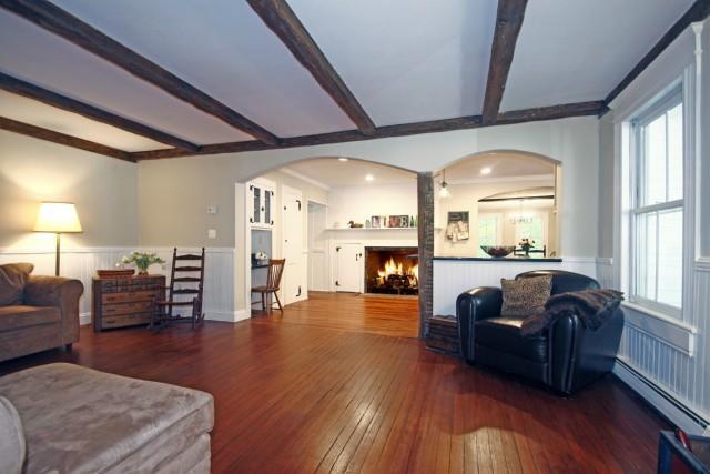a living room with furniture window and wooden floor