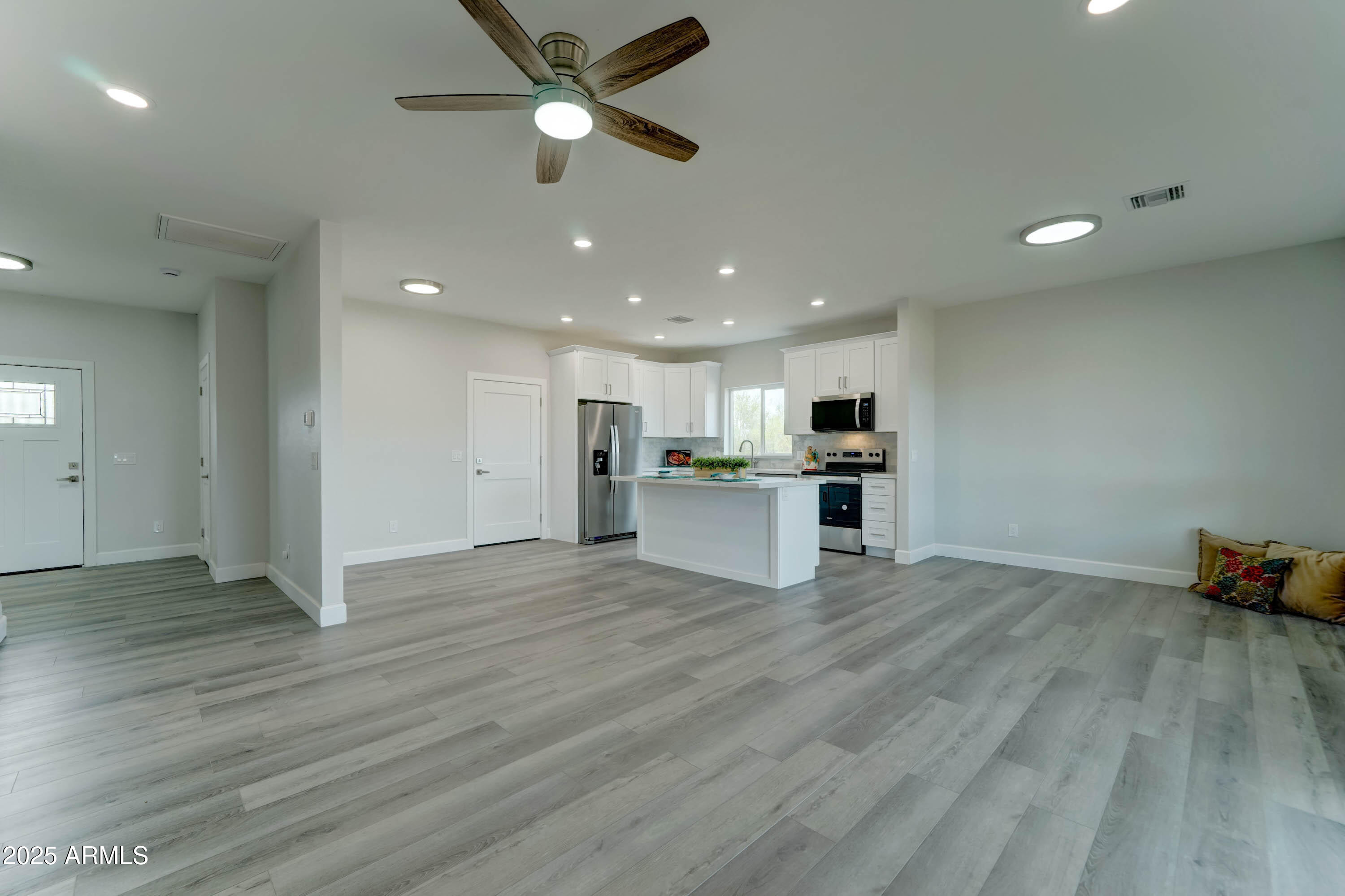 4294 North Wolverine Pass Road Apache Junction, AZ 85119 - Photo 4 of 37 a view of kitchen with granite countertop cabinets and wooden floor