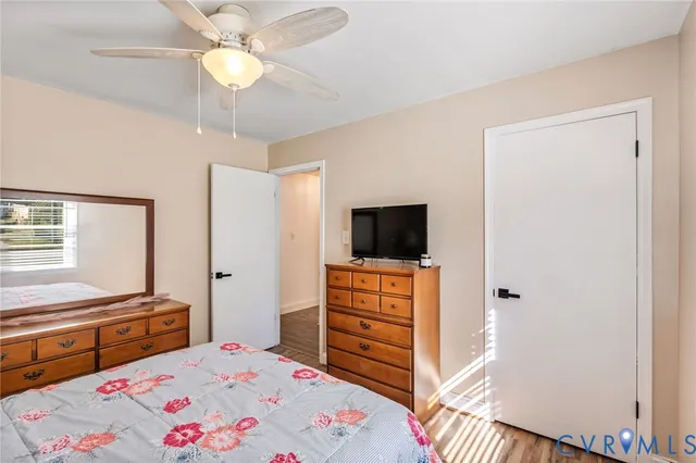 a bedroom with a bed and a television in it