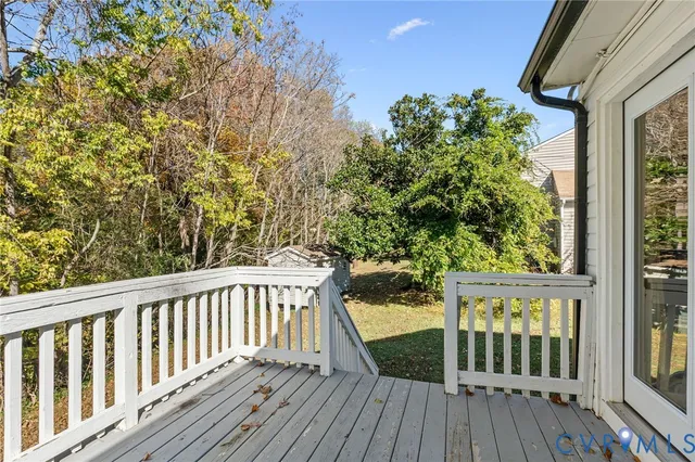 a view of balcony with wooden floor