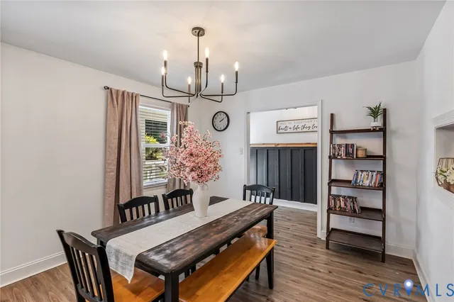 a view of a room with furniture and wooden floor