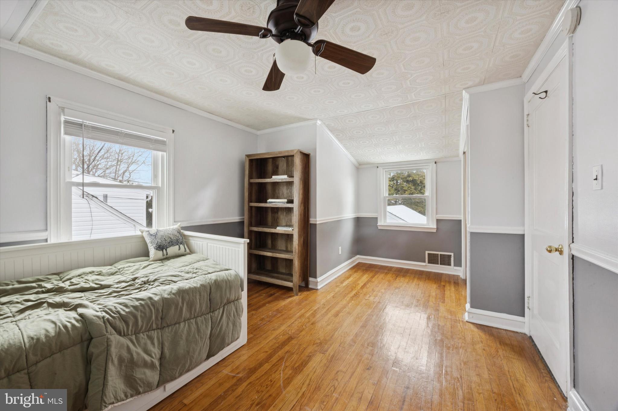 933 Greenbriar Lane Springfield, PA 19064 - Photo 11 of 20 a bedroom with a bed and a view of kitchen