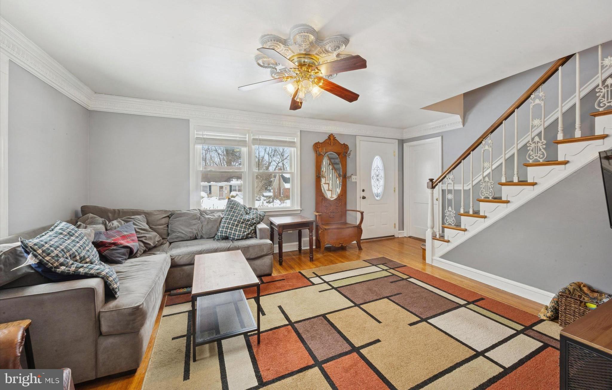 933 Greenbriar Lane Springfield, PA 19064 - Photo 4 of 20 a living room with furniture and a dining table