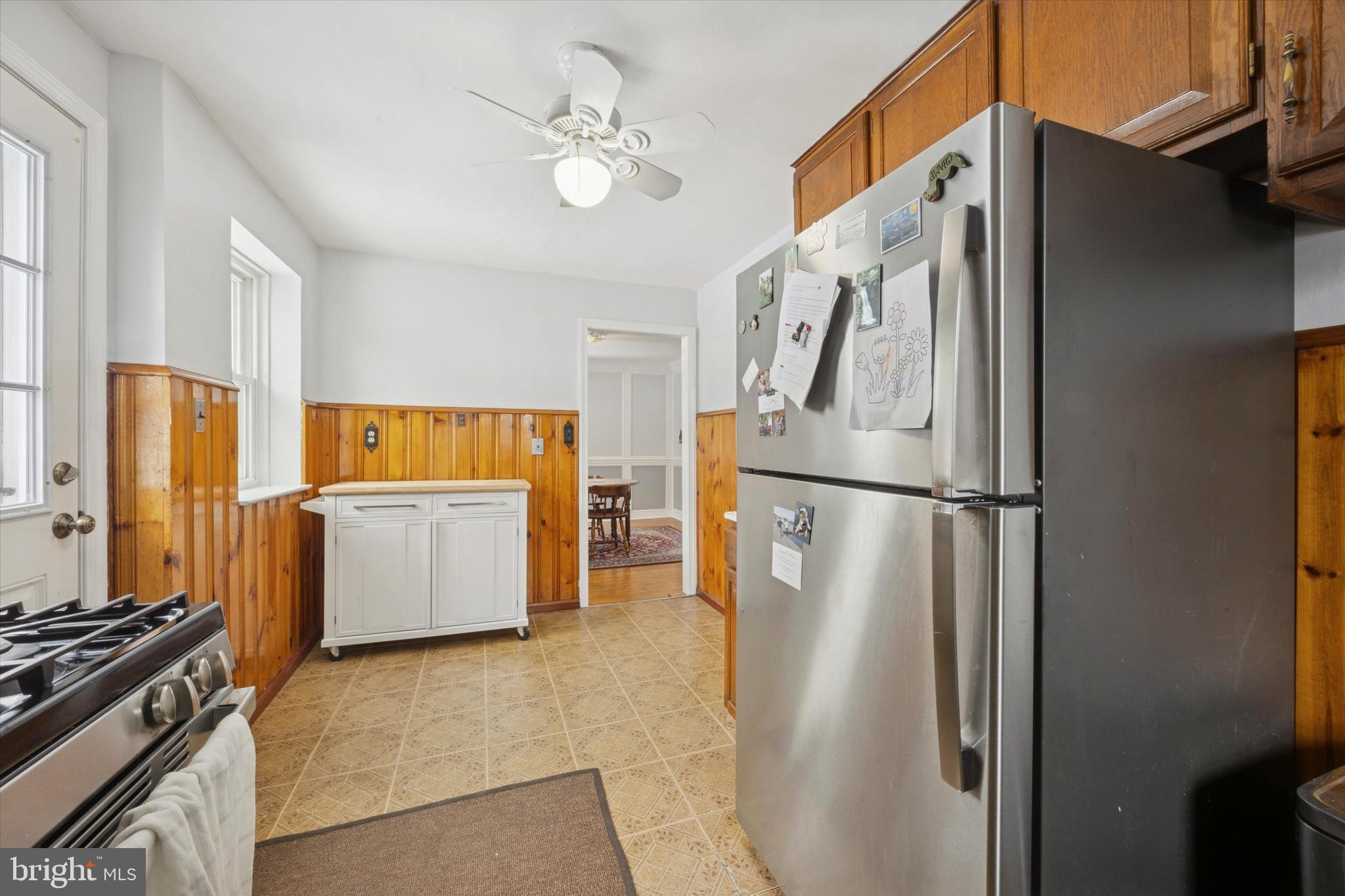 933 Greenbriar Lane Springfield, PA 19064 - Photo 7 of 20 a kitchen with stainless steel appliances granite countertop a refrigerator a stove and a sink