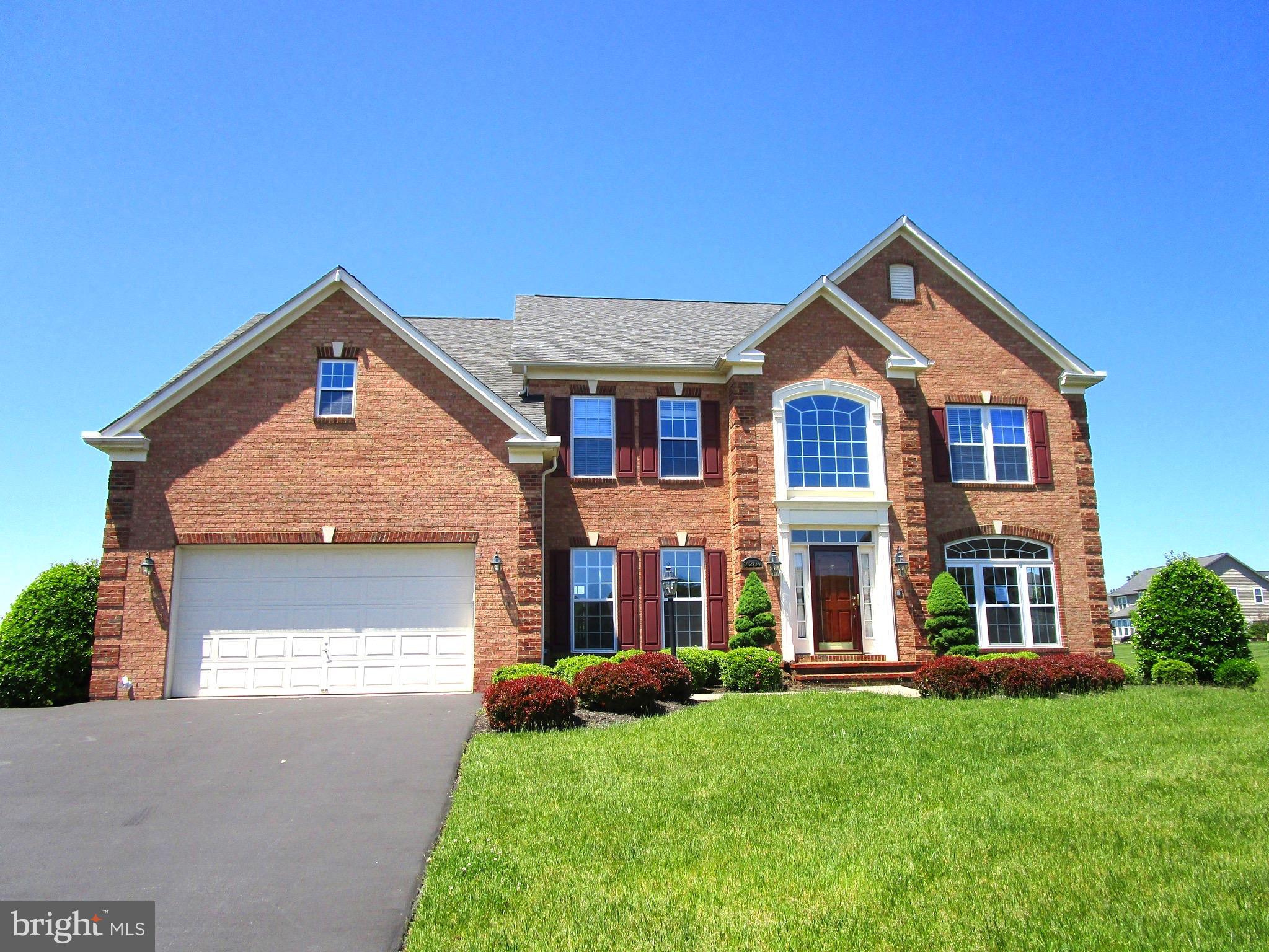 14204 Derby Ridge Road Bowie, MD 20721 - Photo 1 of 27 a front view of a house with a yard