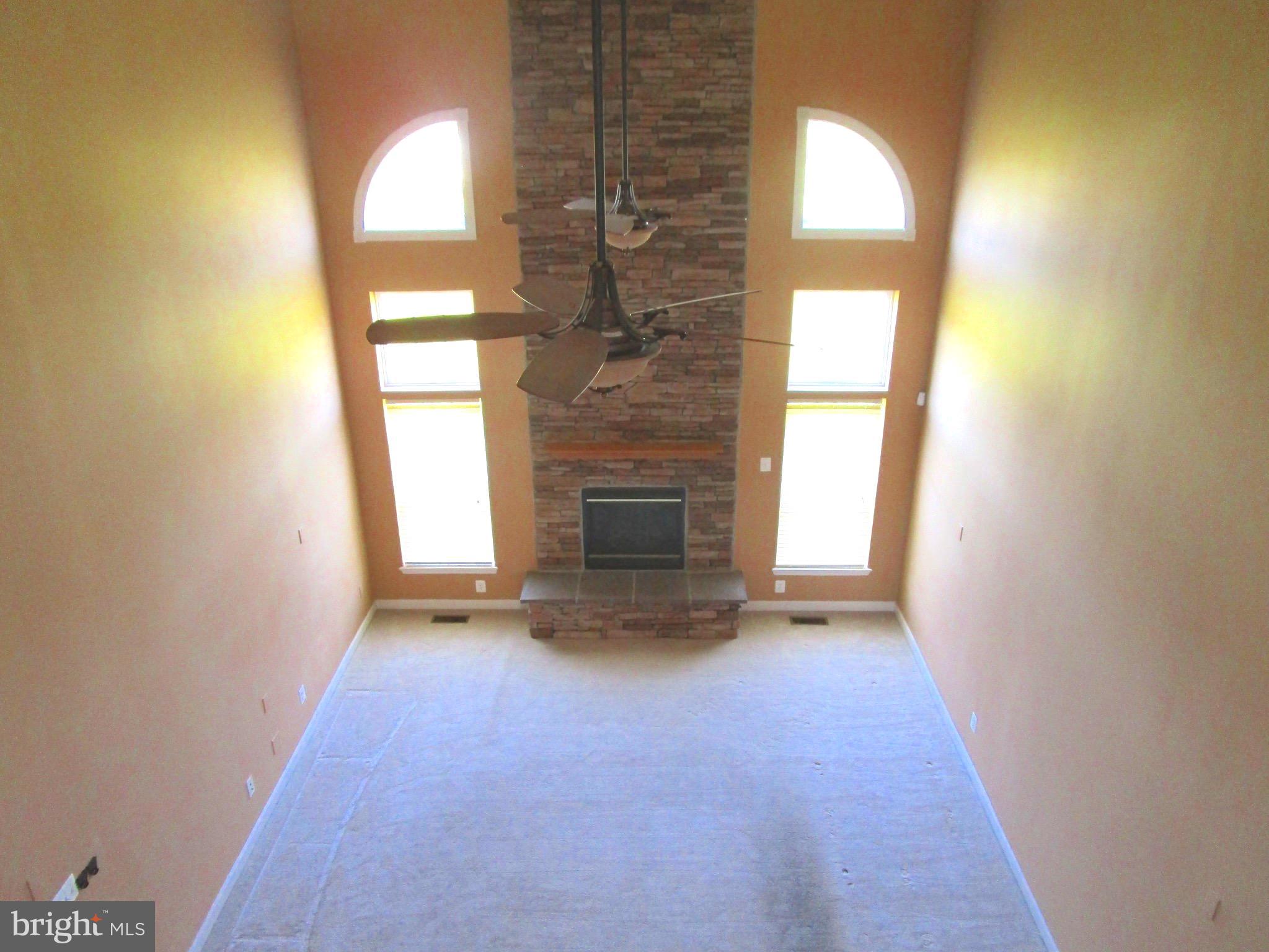 14204 Derby Ridge Road Bowie, MD 20721 - Photo 12 of 27 a view of empty room with a fireplace