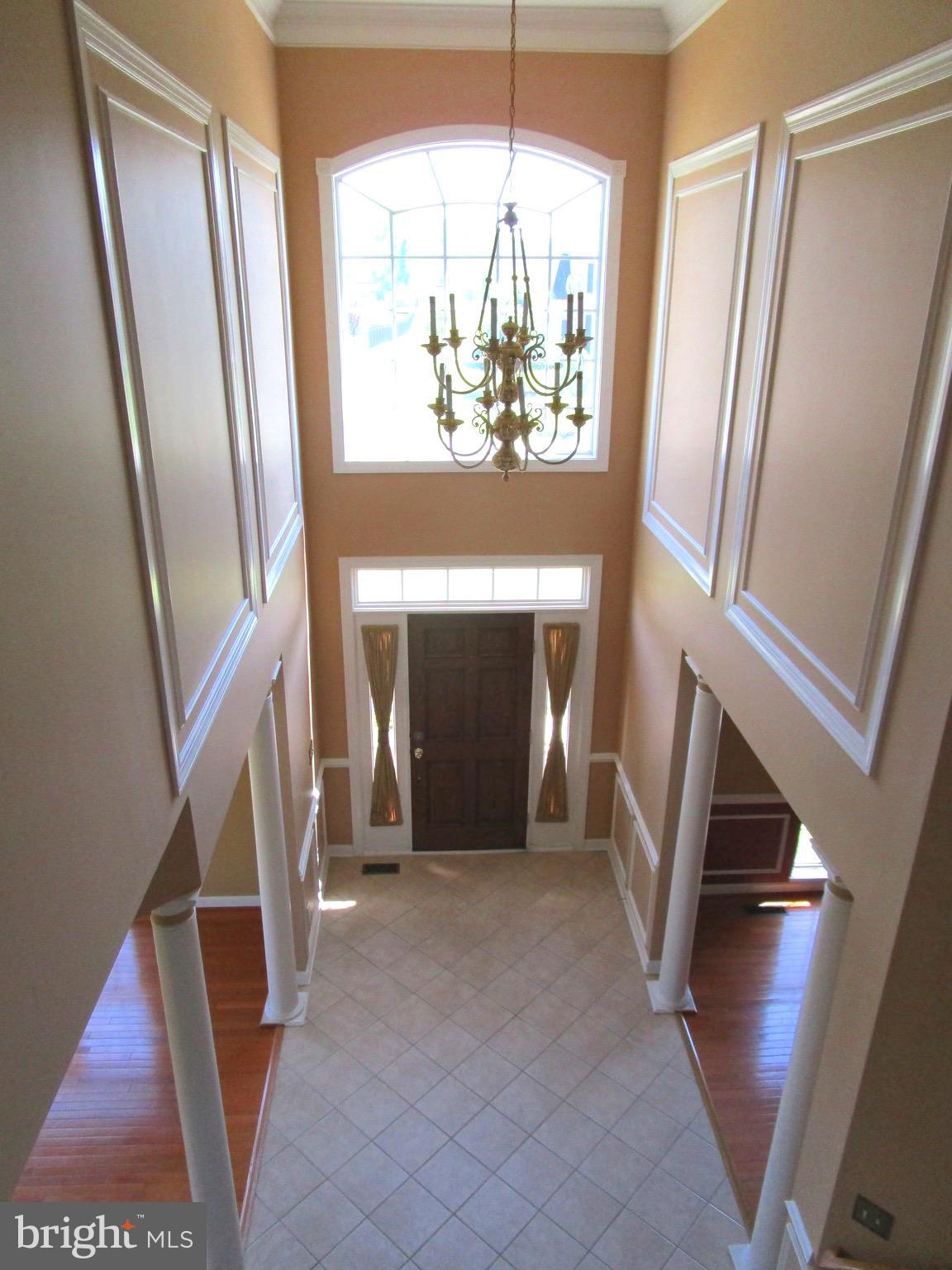 14204 Derby Ridge Road Bowie, MD 20721 - Photo 13 of 27 a view of an entryway with wooden floor and staircase