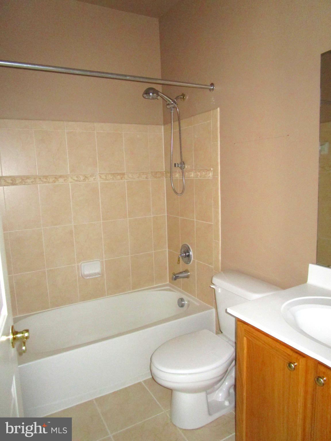 14204 Derby Ridge Road Bowie, MD 20721 - Photo 23 of 27 a bathroom with a sink a toilet and a bathtub