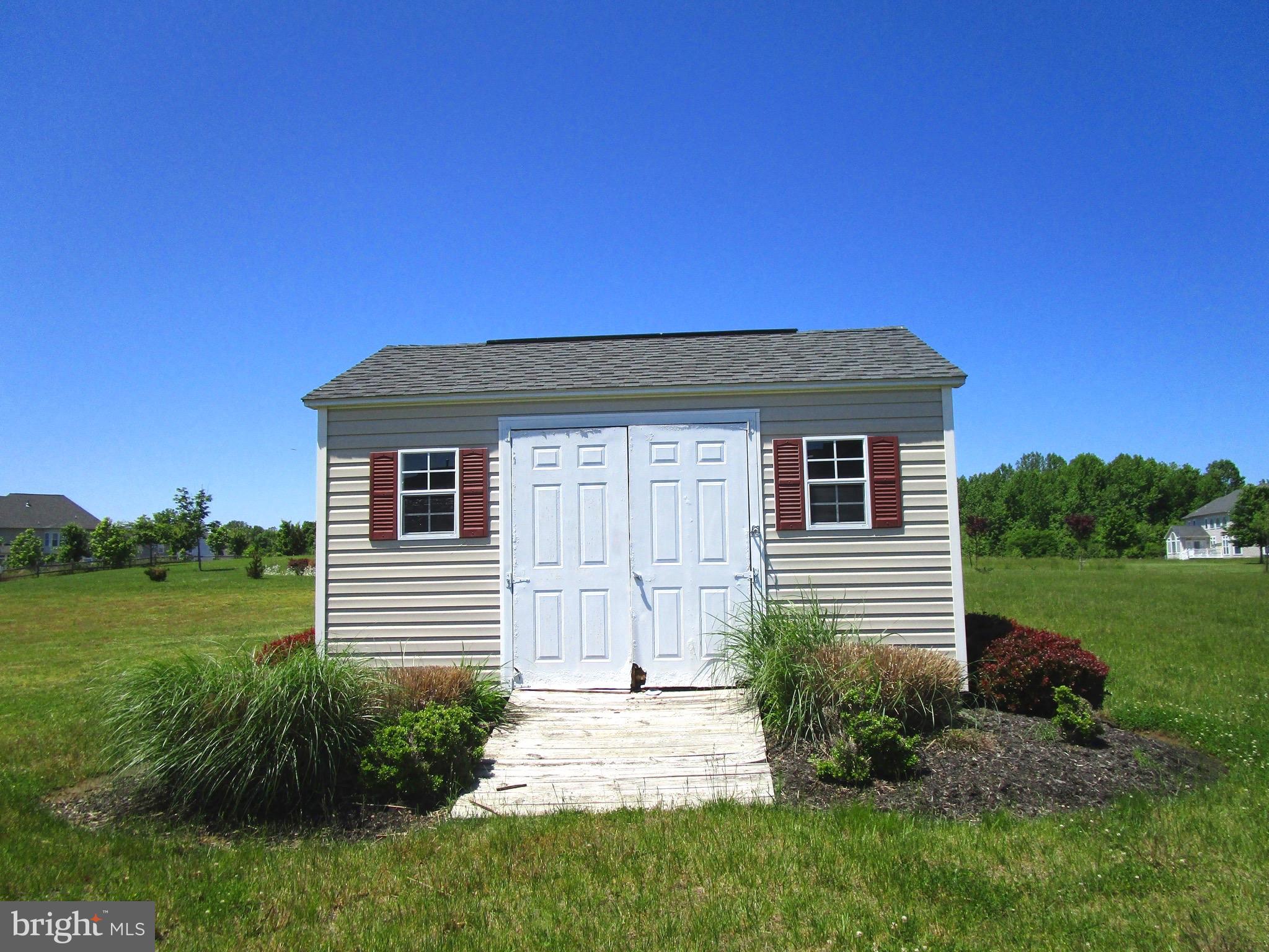 14204 Derby Ridge Road Bowie, MD 20721 - Photo 26 of 27 a front view of a house with a yard