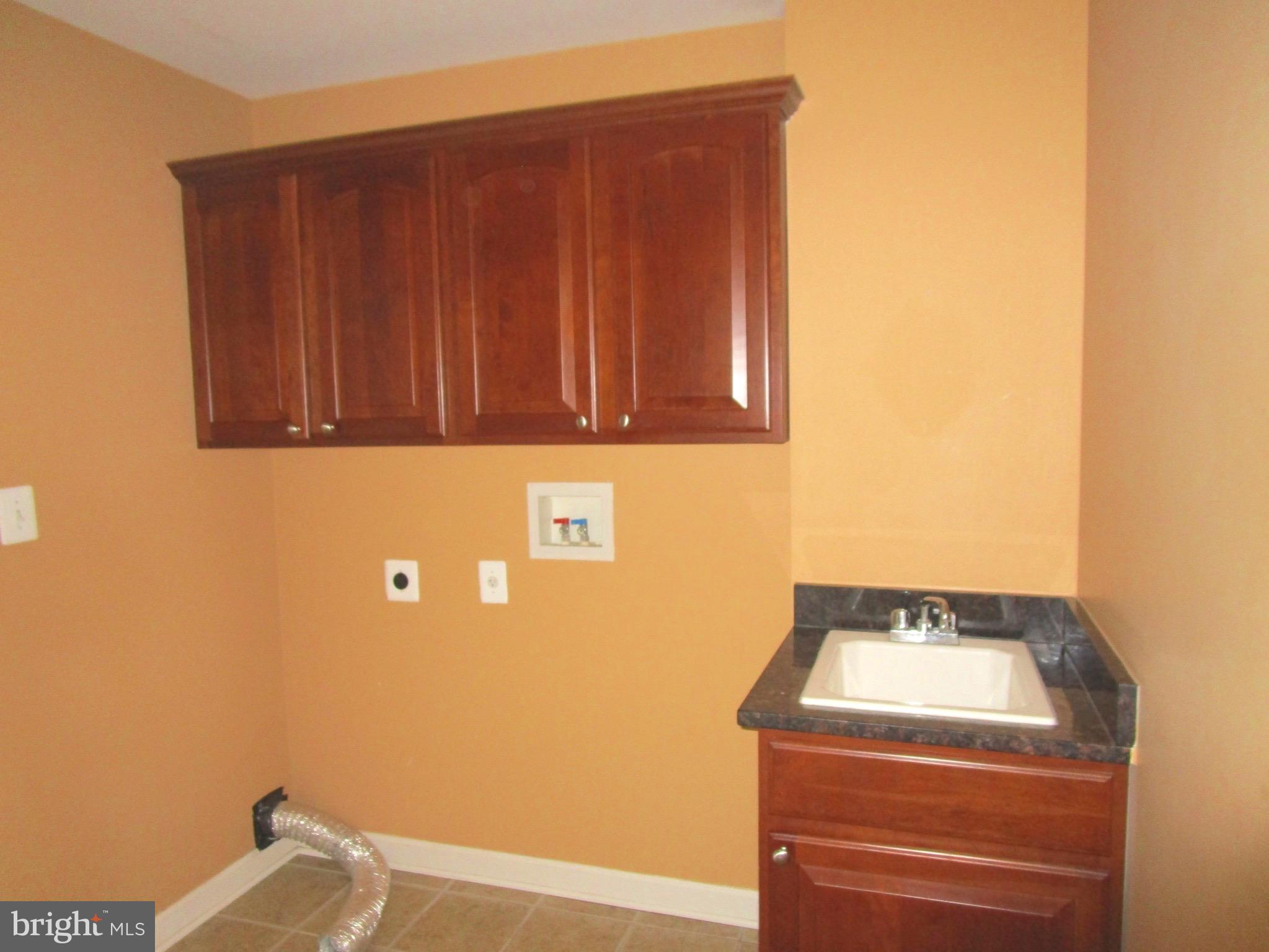 14204 Derby Ridge Road Bowie, MD 20721 - Photo 10 of 27 a utility room with dryer and washer