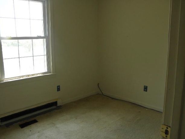 2491 Locust Grove Church Road Orange, VA 22960 - Photo 5 of 11 an empty room with a window