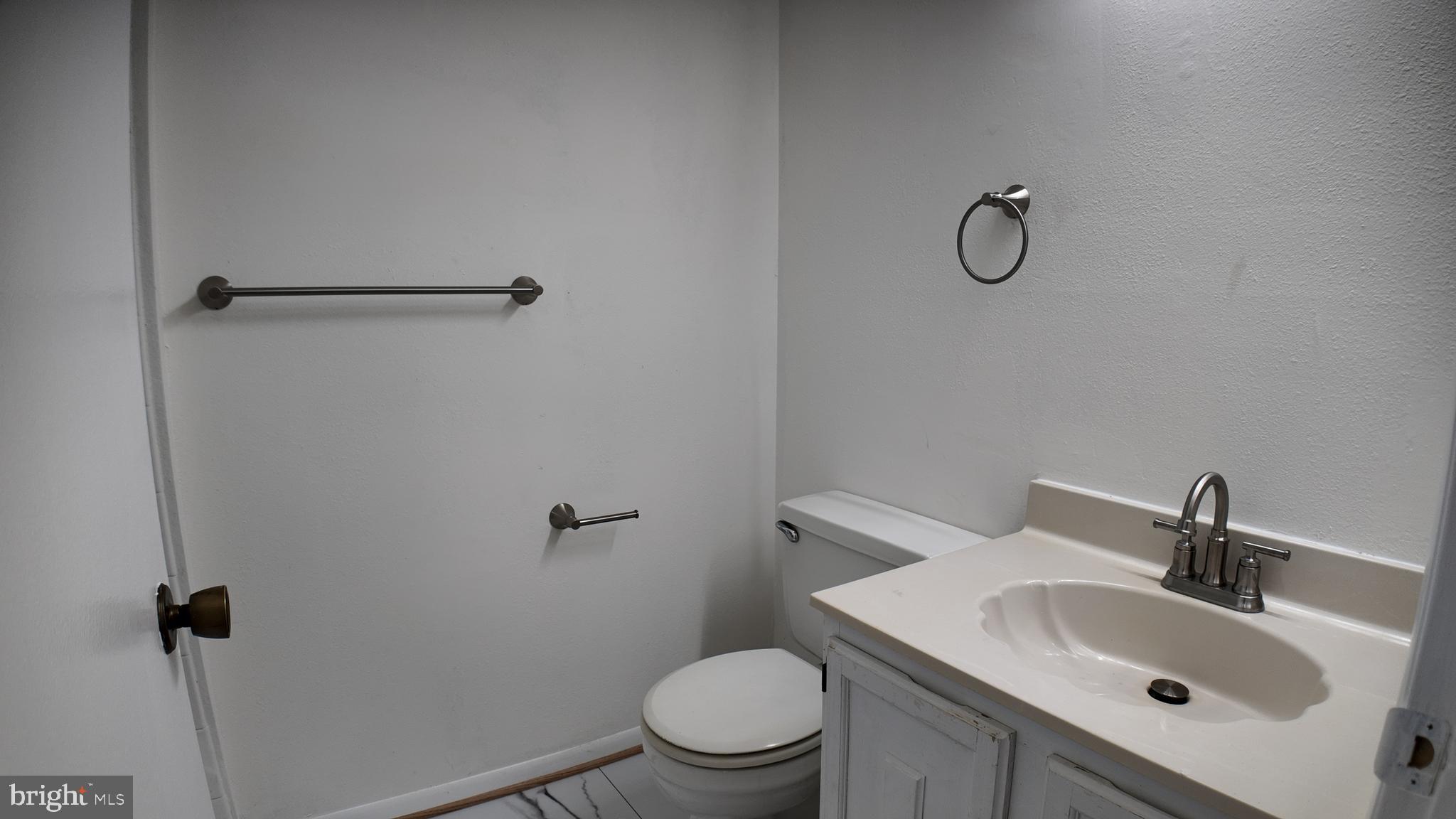 15311 Beaverbrook Court, Unit 903B Silver Spring, MD 20906 - Photo 24 of 36 a bathroom with a sink a toilet and shower