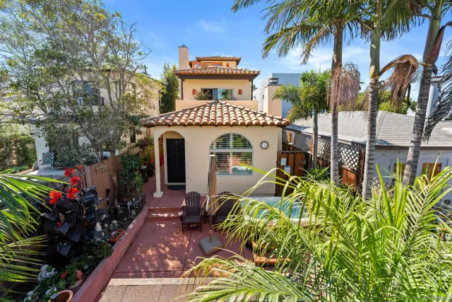 a view of living room with furniture and a potted plant