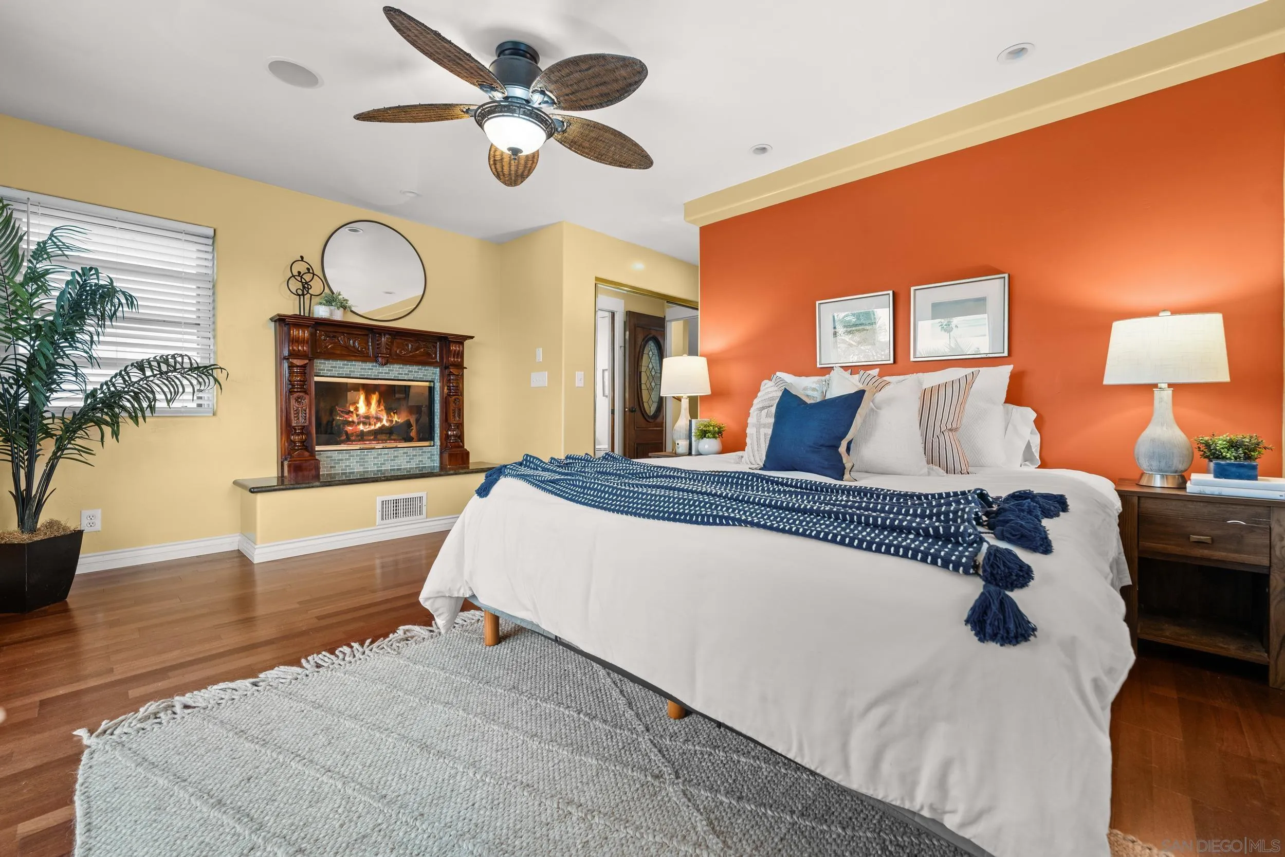 4685 Long Branch Avenue San Diego, CA 92107 - Photo 15 of 27 a spacious bedroom with a bed and a chandelier