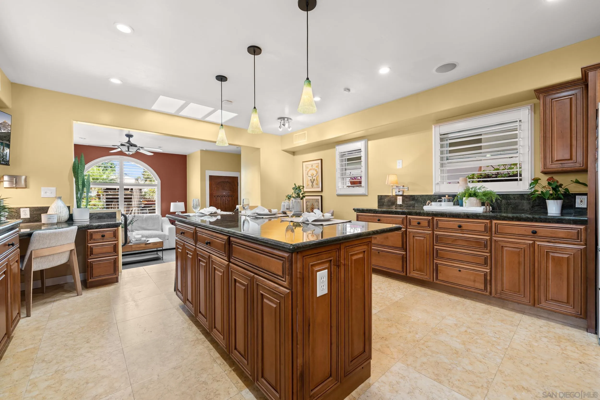 4685 Long Branch Avenue San Diego, CA 92107 - Photo 7 of 27 a kitchen with stainless steel appliances granite countertop stove top oven and cabinets